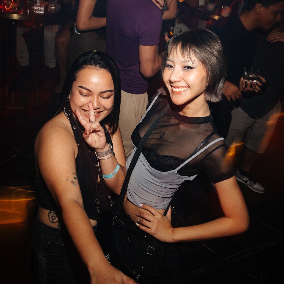 Friends partying at Mustache Bangkok techno club